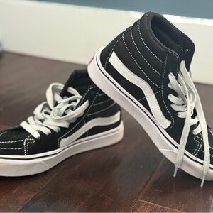 Vans Black and White High-Top Sneakers with Iconic Design